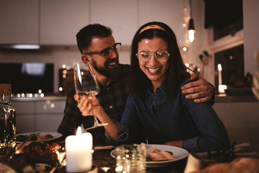 Laughing,Young,Woman,Drinking,Wine,While,Sitting,With,Friends,Around